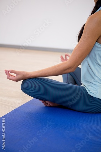 Woman sitting in lotus pose