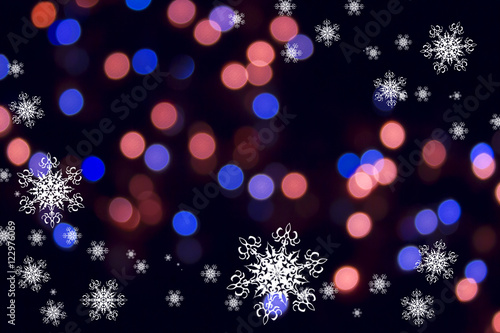 Christmas or new year pattern ,white snowflakes on the pink and blue bokeh background