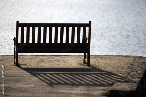 Bench by the Sea, Conleau island, town of Vannes, departament of Morbihan, region of Brittany, France photo