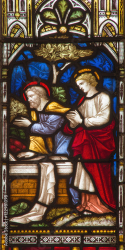 ROME, ITALY - MARCH 9. 2016: The Visit of Peter and John to the Empty Tomb on the stained glass of All Saints' Anglican Church by workroom Clayton and Hall (19. cent.)