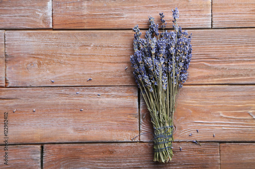 Bunch of lavender flowers on brown wooden background