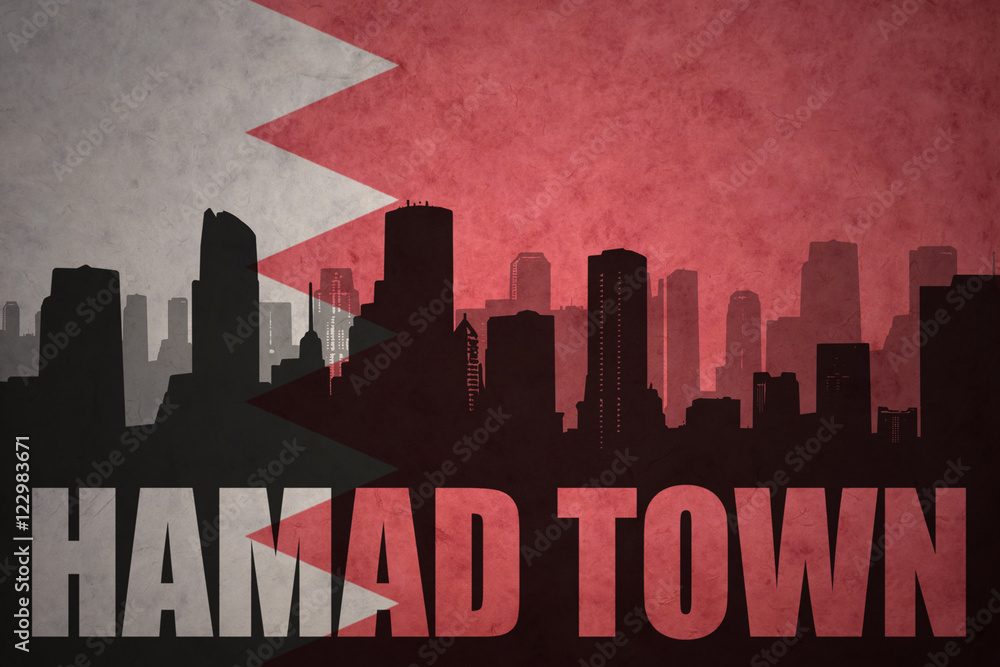 abstract silhouette of the city with text Hamad Town at the vintage bahrain flag background
