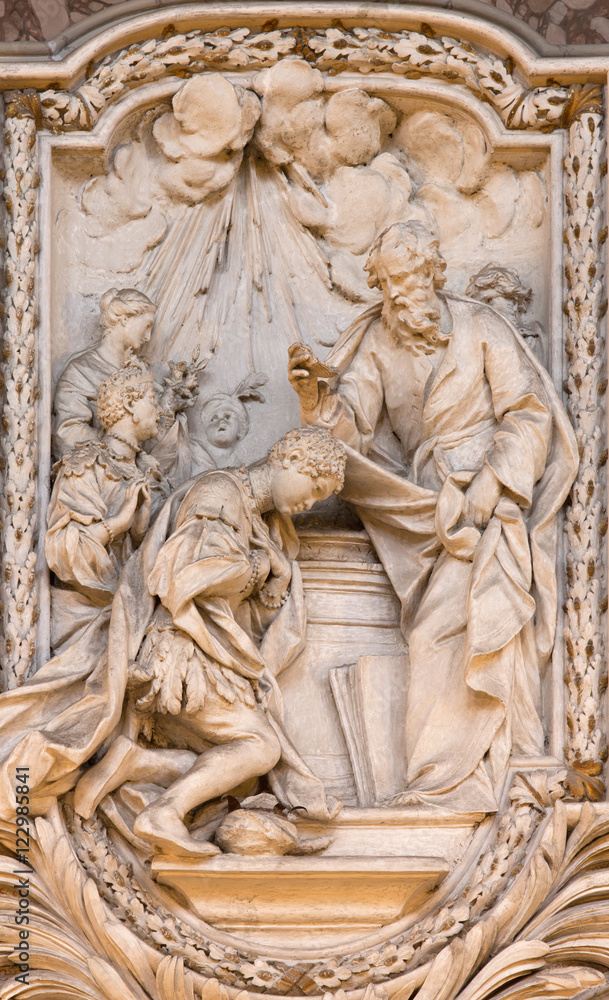 ROME, ITALY - MARCH 10, 2016: The relief of The Baptism of the Eunuch from life of St. Philip the Apostle in church Basilica di San Marco by Carlo Monaldi (1741).