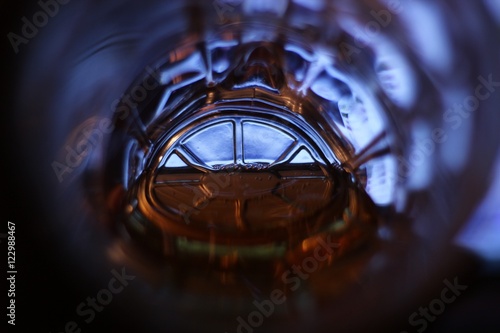 Foto Light in the end of a tunnel (a bottom of a beer mug with beer)the world eyes of