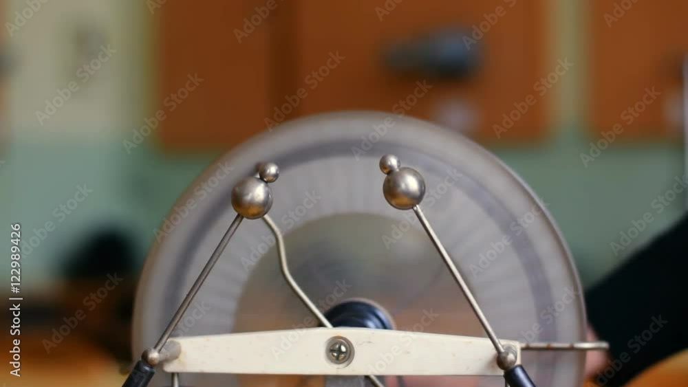 Discharges at the electrodes during rotation the electrophorus generator. Discharges at the electrodes during rotation the electrophorus generator.