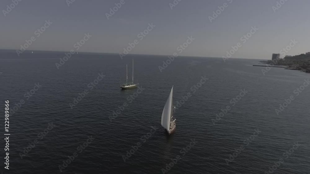 One romantic alone boat in blue sea, bird's eyes view One romantic alone boat in blue sea, bird's eyes view