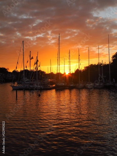 Yachts silhouettes at sunset over Spa Creek, Annapolis MD. 