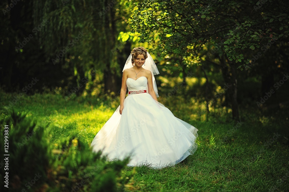 Young blonde bride at the garden Young blonde bride at the garden