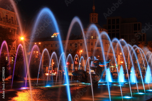 Beautiful multi-colored fountain near the Opera House in the city Dnepr at night (Dnepropetrovsk), Ukraine.