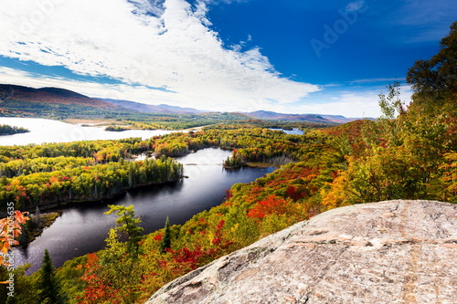 Autumn beginning to take affect on cottage country in the Quebec north. Trees turning blood red before the winter onslaught.