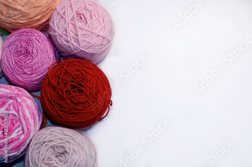 Balls of wool cotton silk yarn set on copy space white background on right