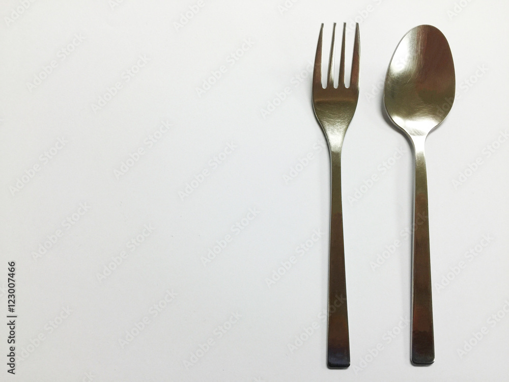 Silver spoon and flog on white background copy space Silver spoon and flog on white background copy space