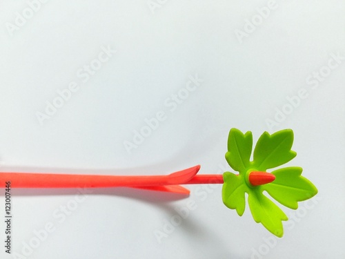 Orange flower pen on white background copy space photo