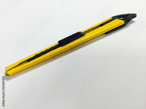 Yellow cutter on white background