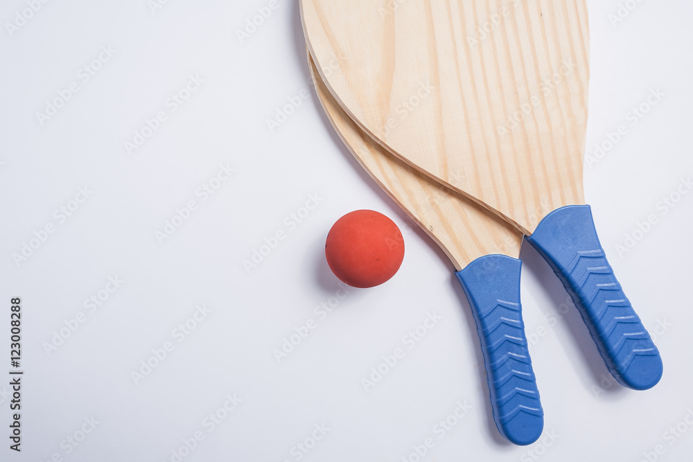 Beach tennis, beach paddle ball, matkot. Beach rackets and ball, overhead view. Beach tennis, beach paddle ball, matkot. Beach rackets and ball, overhead view.