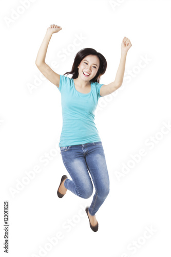 Beautiful woman jumping in the air