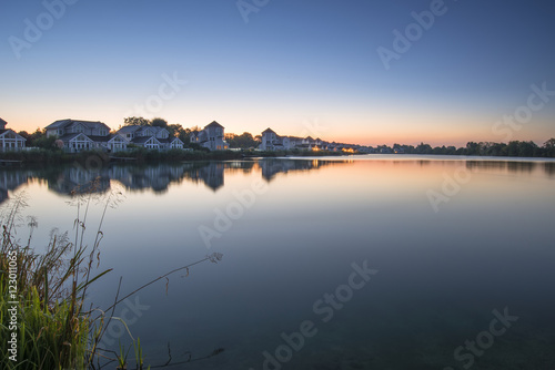 Stunning dawn landscape image of clear sky over calm lake