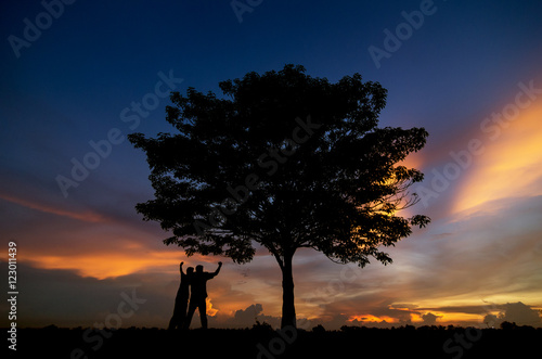 silhouette of trees and men happy © 24Novembers