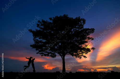 silhouette of trees and men happy