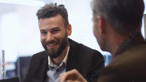 Serious colleagues discussing new business plan.