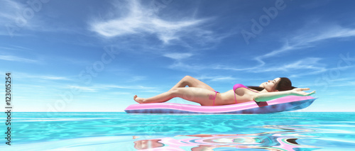 Happy woman on pink air bed