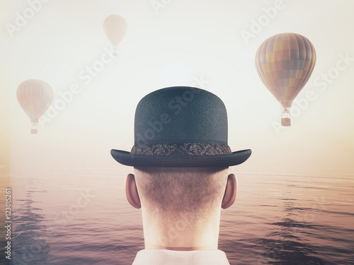Man looks at hot air balloons