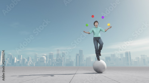 фотографія Man juggles the ball in balance