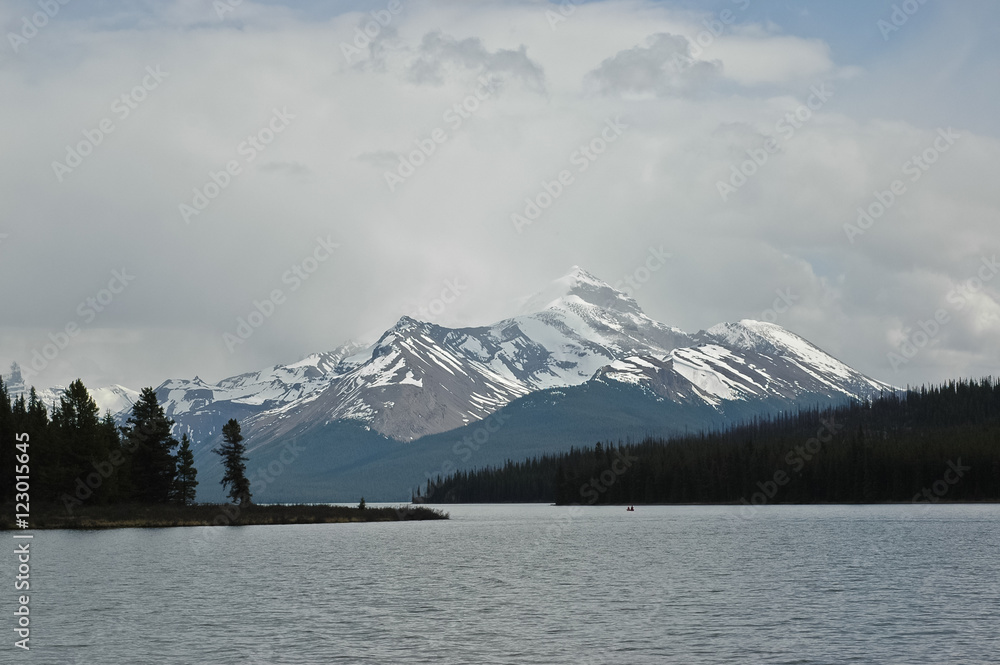 snow mountain and calm lake