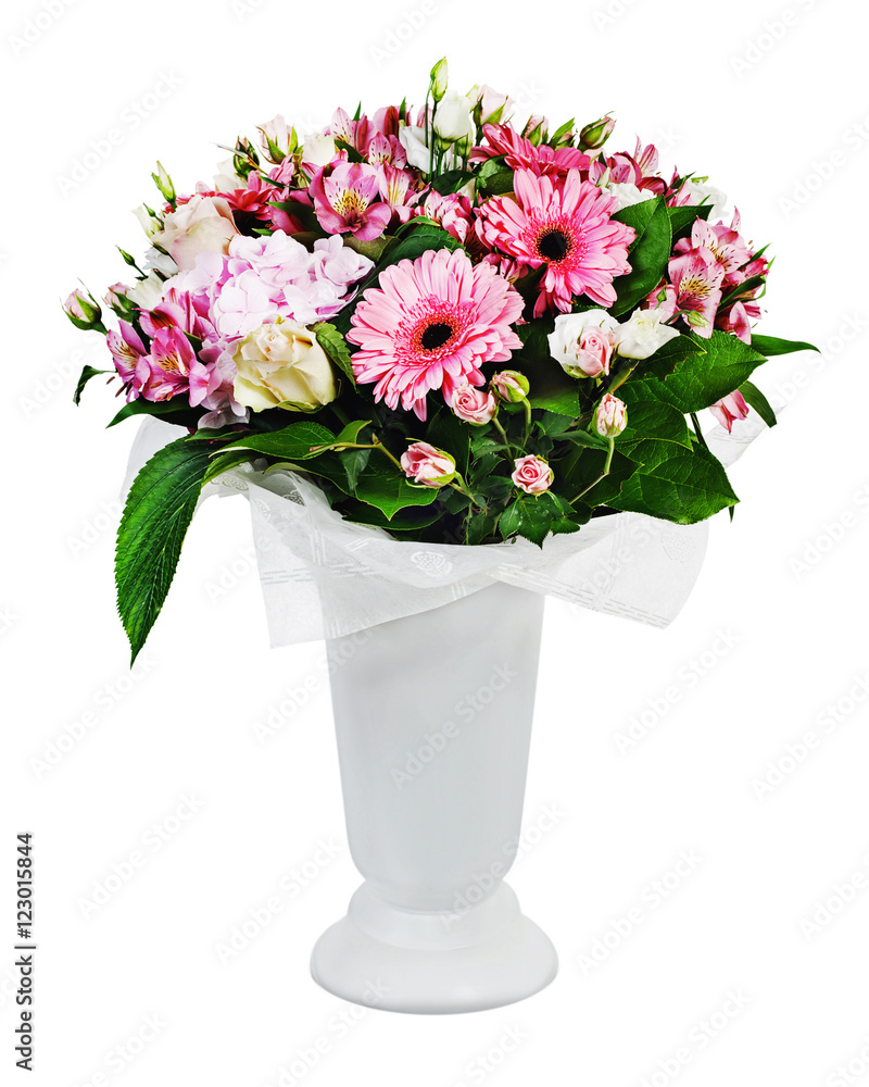 Colorful floral bouquet of roses, lilies and orchids arrangement centerpiece in vase isolated on white background.