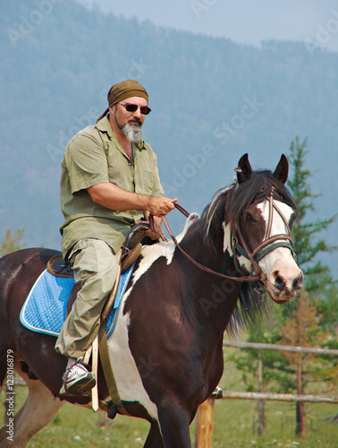 Horseman on the mountain landscape