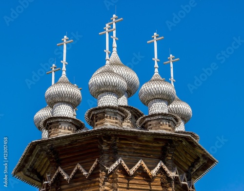 Domes of Church of the Intercession against deep blue sky, Kizhi Island, Russia. Ancient wooden architecture. UNESCO heritage landmark