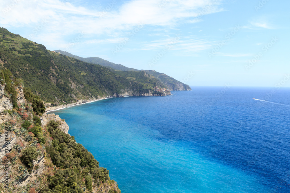 Rocky coast and Cinque Terre village Manarola and Mediterranean Sea, Italy Rocky coast and Cinque Terre village Manarola and Mediterranean Sea, Italy