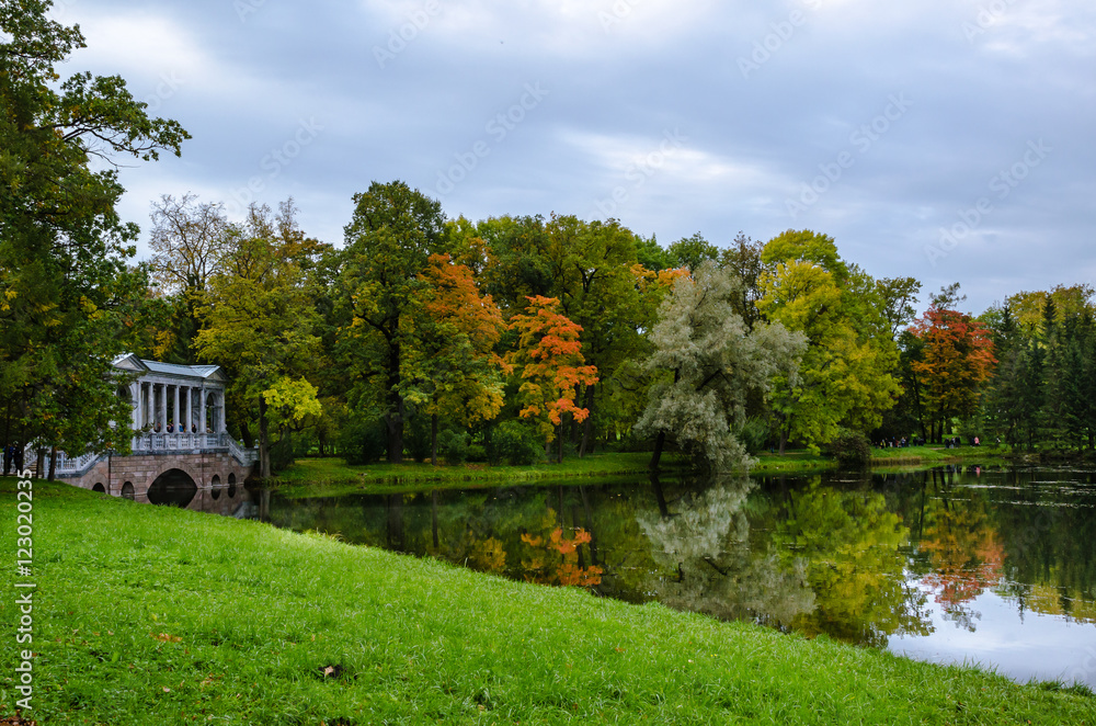 Autumn landscape in the Park with a marble bridge