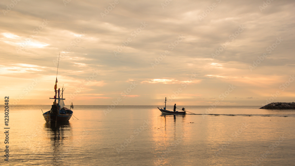 a boat at sunrise