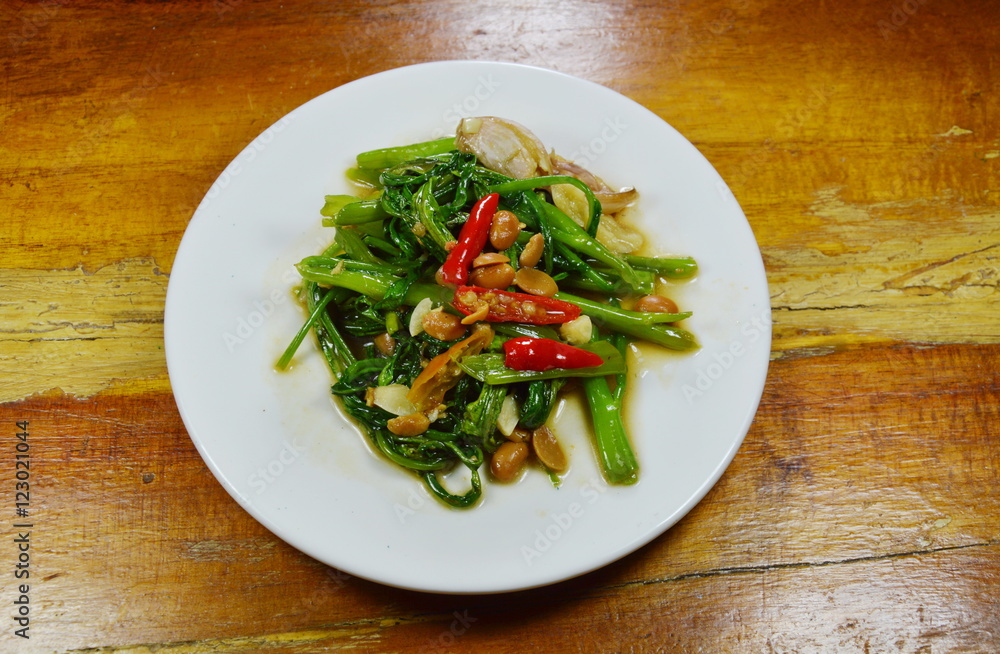 stir fried morning glory with chili and soy bean paste on dish stir fried morning glory with chili and soy bean paste on dish