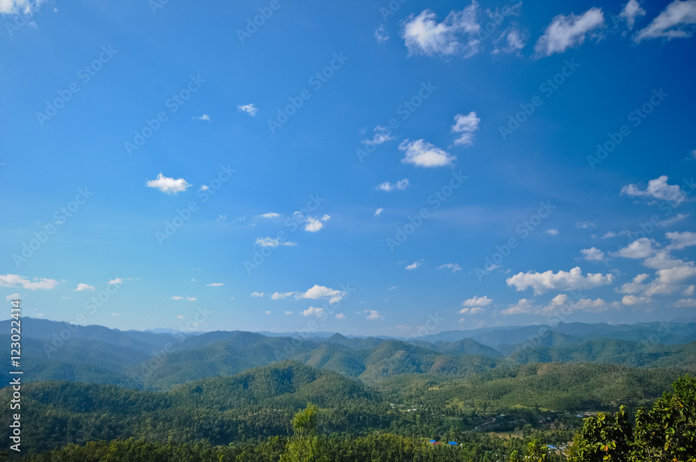 Scenic giant green valley and blue sky in bright Summer day Scenic giant green valley and blue sky in bright Summer day