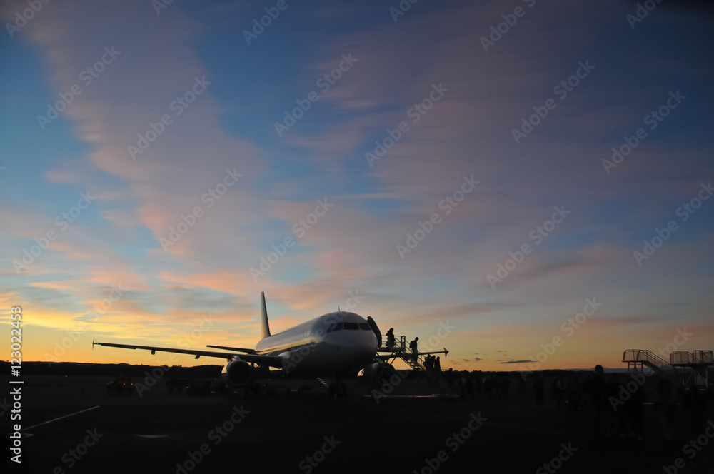 Airplane at the early morning with passengers