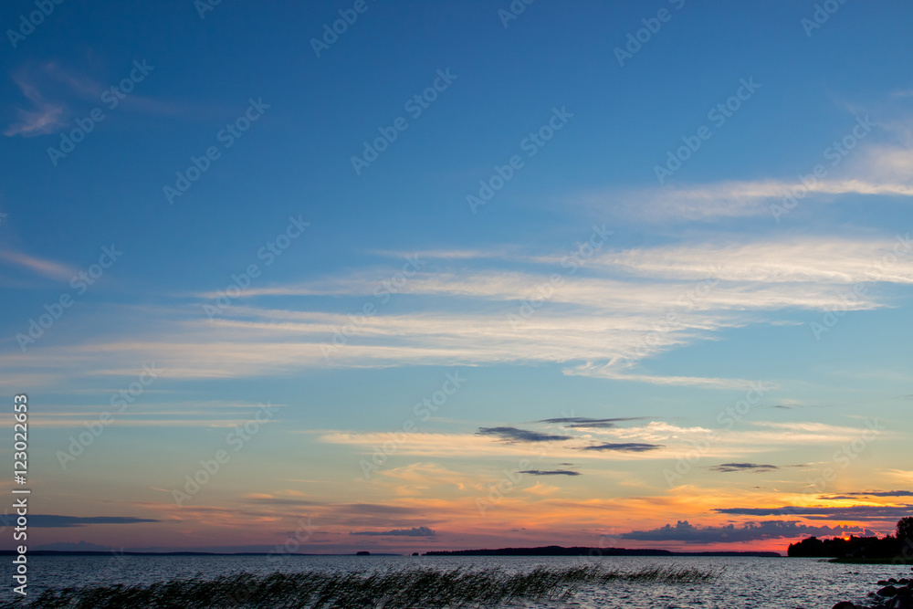 Beautiful tranquil summer sunset on the Onega lake, Karelia, Russia