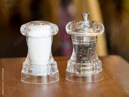 Принти на полотні Pepper and salt in glass bottle on wood table