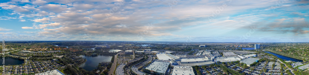 Panoramic aerial view of mall parking area at dusk