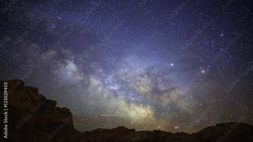 Astrophotography time lapse with tilt up motion of Milky Way galaxy rising over Elephant Rock in Valley of Fire State Park, Nevada Astrophotography time lapse with tilt up motion of Milky Way galaxy rising over Elephant Rock in Valley of Fire State Park, Nevada