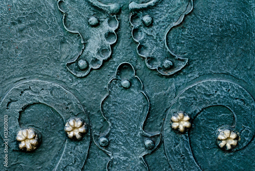embossed metallic green-blue background with baroque details and with buttons and metal gold  flowers