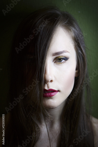 Wallpaper Mural Portrait of a beautiful young girl on a dark background Torontodigital.ca