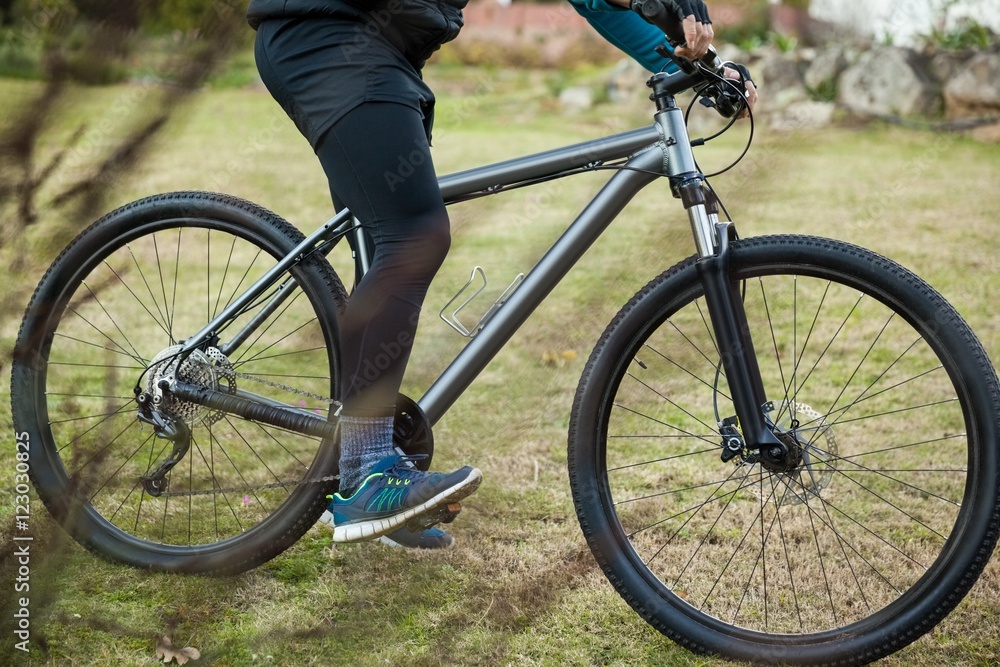 Fototapeta premium Male mountain biker riding bicycle