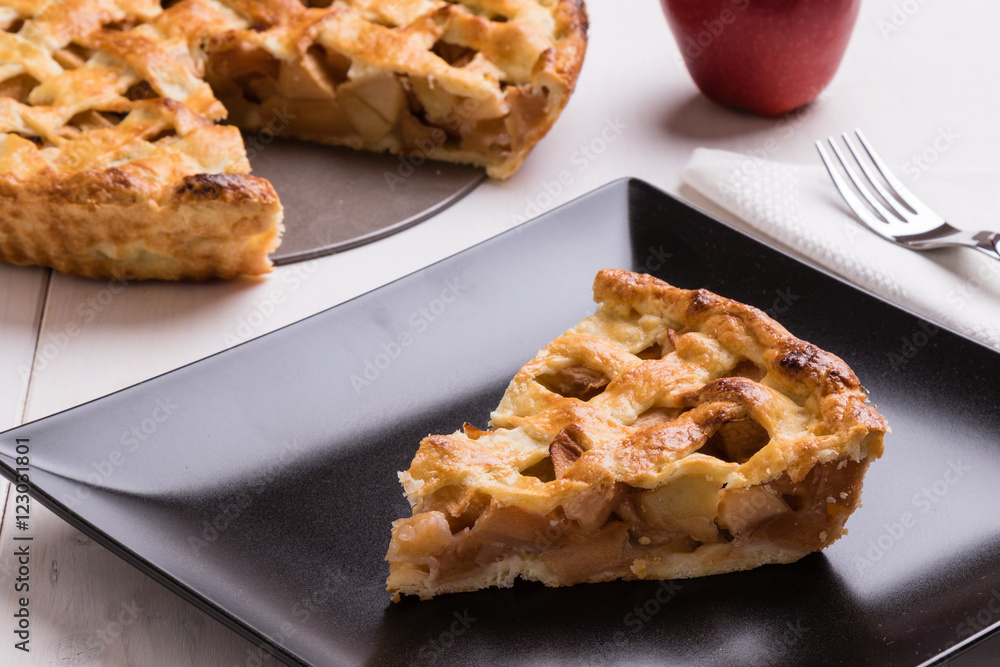 apple pie slice on black plate apple pie slice on black plate