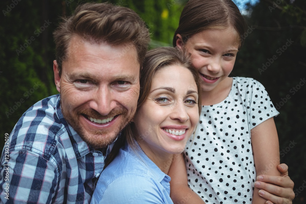 Portrait of happy family smiling in park Portrait of happy family smiling in park