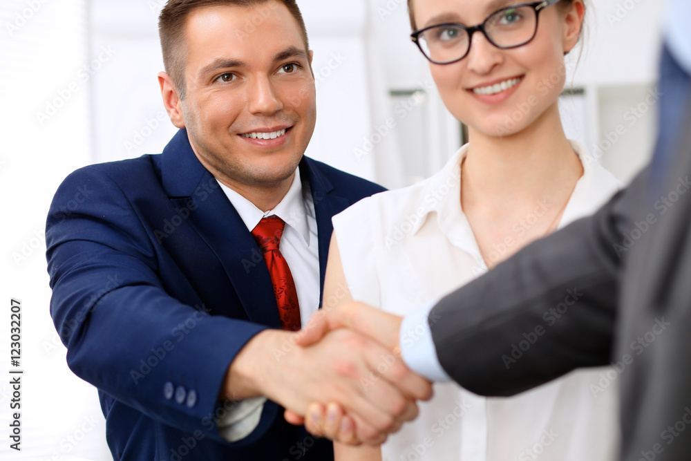 Fototapeta premium Two business man shaking hands to each other finishing up the meeting
