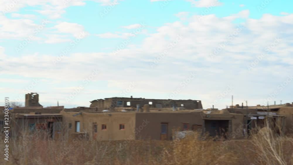 Pan Shot of Traditional Indian House in Taos Pueblo, New Mexico -Pan Right/Long- Pan Shot of Traditional Indian House in Taos Pueblo, New Mexico -Pan Right/Long-