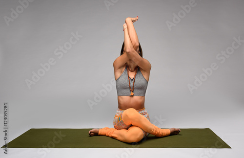 Gomukhasana yoga pose photo