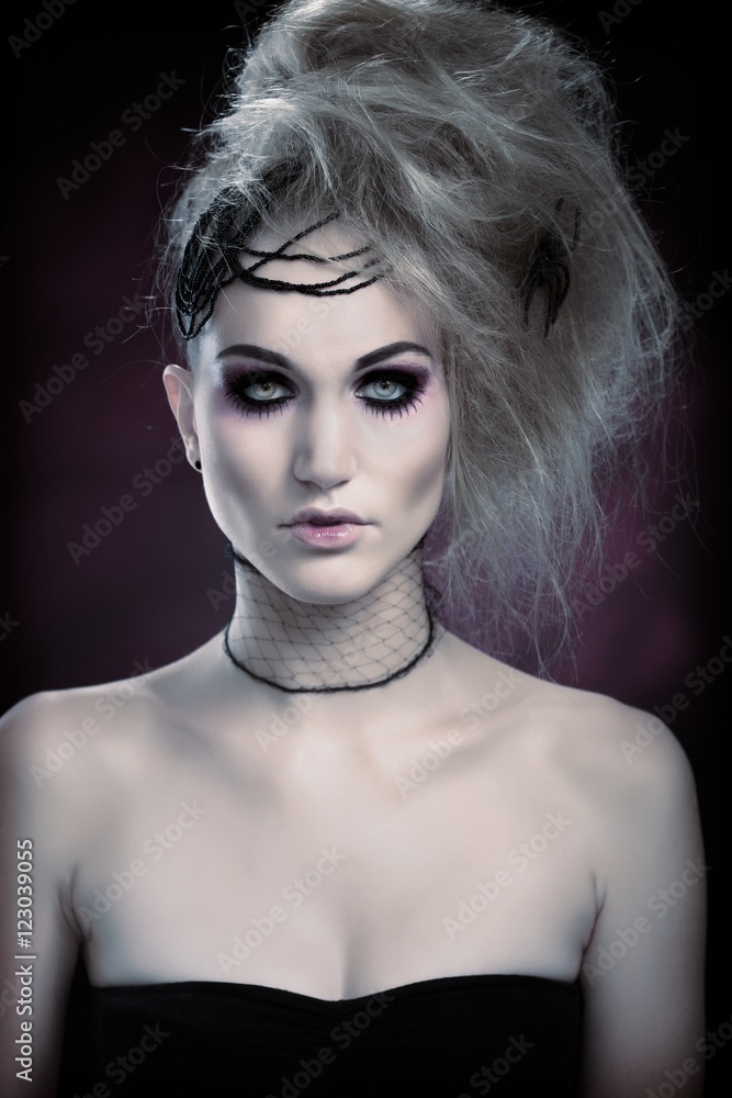 Decorative woman in spooky makeup